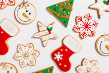 Pattern Of Various Christmas Cookies Flat Laid Against White Background