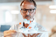 © Westend61 - Male entrepreneur brainstorming on molecule structure at office