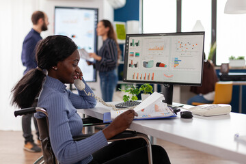 Poster - handicapped african american businesswoman talking with manager at landline explaining company strat