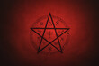 Leinwandbild Motiv Pentagram symbol painted on paper with black paint. Occult and esoteric symbols. Spell or black magic ritual. Red color.