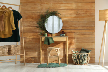 Canvas Print - Stylish dressing table and mirror decorated with green eucalyptus in room