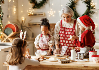 Poster - Multiethnic family, grandmother and three little kids, cooking Christmas cookies together in kitchen