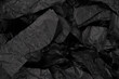© Nikolay - Abstract black paper texture background. Top view.