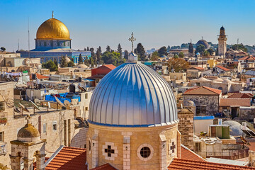 Wall Mural - Panoramic view of Dome of Armenian Church of Our Lady of Spasm and Dome of Rock, Temple Mount, and ancient rooftops of old city of Jerusalem, Israel from roof Austrian Hospice of Holy Family