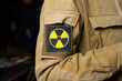 liquidator uniform with the sign of radiation of the consequences of an accident at the nuclear reactor of a nuclear power plant