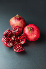 Wall Mural - delicious healthy ripe fruit with pomegranate seeds red cut