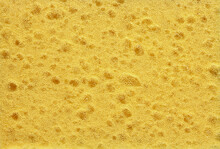 Texture Or Background Of Yellow Synthetic Sponge.
