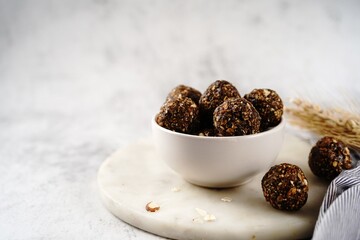 Wall Mural - No bake raw energy protein balls with oats nuts and dates, selective focus