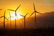 © squeemu - The sun sets over a windmill farm in Palm Springs, California