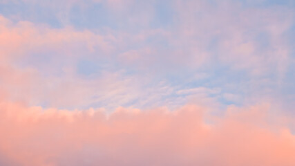 Wall Mural - Background of blue sky with pale pink clouds in sunset