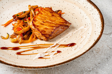 Wall Mural - roasted salmon with vegetables and sauce