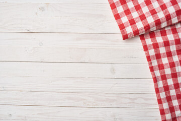 Wall Mural - Red checkered tablecloth wooden background texture kitchen decoration