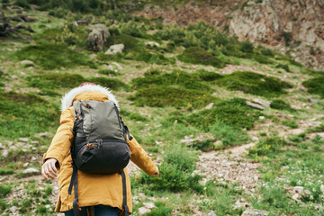 Wall Mural - woman hiker with backpack mountains travel adventure freedom