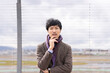 © 茂輝 田代 - 人物　スーツ　空港　男性