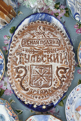 Wall Mural - Tula's “carrot” (Tula's gingerbread, spice cake). Table setting, traditonal national russian folk handicraft: gzhel. Russian craft ware, plate. Home tea drinking