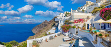 Amazing Cityscape View Of Santorini Island, Oia Village. Picturesque Famous Greek Resort Greece, Europe. Traveling Concept Background. Summer Vacation, Beautiful Windmills And Aegean Colorful Building