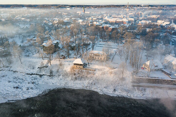 Poster - Aerial view of river Venta and Kuldiga town in foggy winter day, Latvia