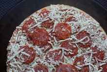 Frozen Pepperoni Pizza On Stone Pan