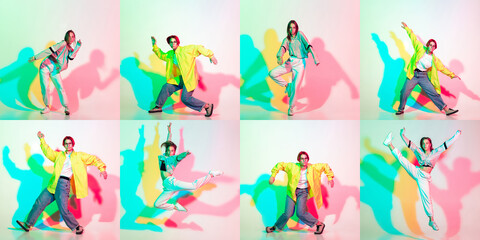 Wall Mural - Two stylish girls, teens dancing hip-hop in stylish clothes on colored studio background with glitch effect.
