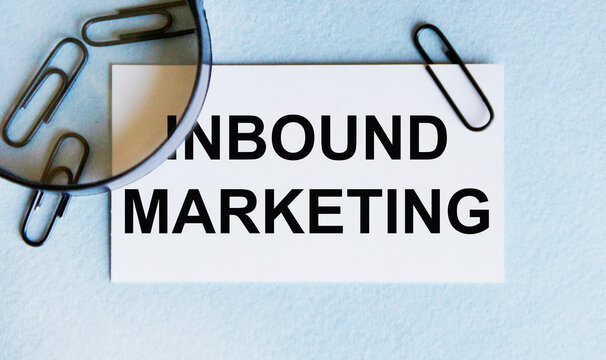 INBOUND MARKETING text written on a paper. The concept of world business, marketing, finance.