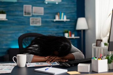 Poster - Exhausted employee falling asleep on desk while working from home on papers with data charts. Woman feeling sleepy and doing remote work for design of business project. Tired person