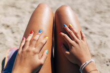 Woman With Colorful Nail Polish Enjoying Sunny Day At Beach