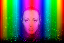 Young Woman With Face Recognition Artificial Intelligence Technology On Multi-colored Background