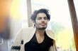 © Westend61 - Portrait of young handsome man wearing cardigan