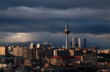  Panorama of city of Madrid, Spain, during sunset, with high tower buildings on background