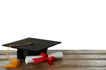 Wall Mural - Graduation hat and diploma on wooden table against  white background, space for text