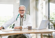 © Westend61 - Male doctor sitting at desk