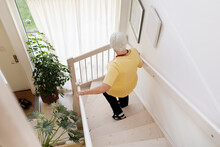 High Angle View Of Woman On Stairs