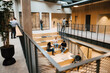 © Johnér - People relaxing on stairs in office building