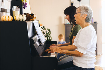 Wall Mural - Family Learning Piano In Living Room At Home