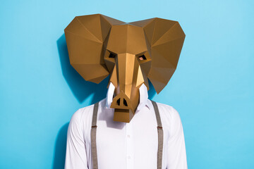 Wall Mural - Photo of serious confident man wear weird elephant mask white shirt isolated blue color background