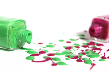 Poster - Pink and Green Spilled Nail Polish on White Background