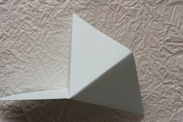 folded card stock object on crumpled paper