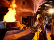 © Westend61 - Worker holding metal rod in furnace at foundry