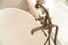 Bronze Faucet On Bathtub