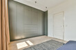 © ADDICTIVE STOCK - Built in gray wardrobe in light bedroom
