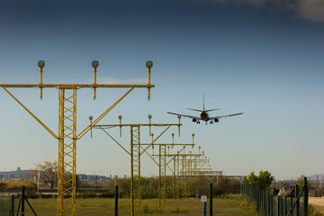 Beacons with lights, marking the entrance to the aircraft for landing on the airport runway.