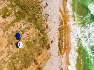 Sticker - Caravan trailer camping on coast. Aerial view