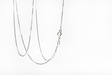 Silver Chain Hanging On A White Background.