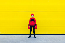 Girl In Boxing Gloves And Hat Standing Near Colorful Wall