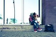 © Alexander - young urban lovers kissing and smiling while having a good time together