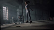 Athlete doing deep squats with jumps. Powerful woman making buttocks workout