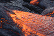 incandescent flowing volcanic lava in volcano