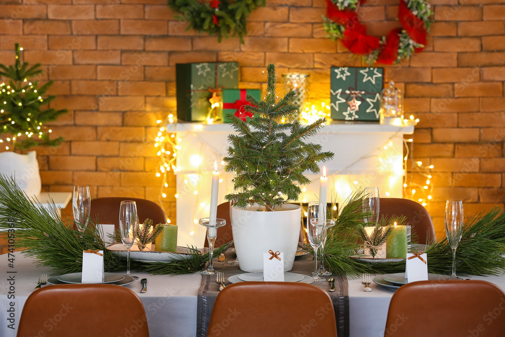 Dining table with beautiful setting in living room decorated for Christmas eve