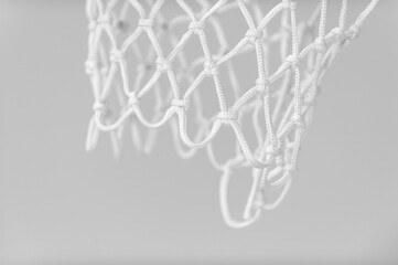 Wall Mural - Empty Swooshing Basketball Net Close Up with gray background. Horizontal sport theme poster, greeting cards, headers, website and app