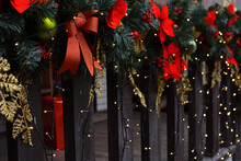 A Beautifully Decorated Wooden Fence With Christmas Decorations. Christmas Mood. Happy New Year And Merry Christmas!